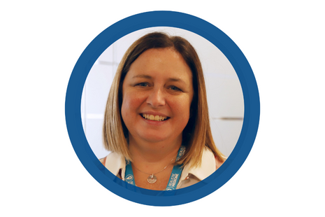 Pictured Dr Lorna Ramsay blonde long bobbed air, wearing a silver spiral necklace and multi-coloured patterned blouse with realistic medicine lanyard.